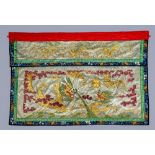 A CHINESE WALL HANGING embroidered in coloured silks on a grey damask ground with two dragons