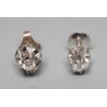 A PAIR OF SOLITAIRE DIAMOND EAR STUDS, the round brilliant cut stones each of approximately 0.050cts