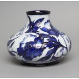 A MOORCROFT POTTERY VASE, 2004, of squat baluster form, tubelined and painted in shades of blue with