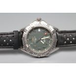 A GENTLEMAN'S BREITLING AUTOMATIC WRISTWATCH, the dark grey dial with silvered Arabic numerals