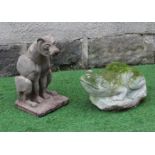 A CARVED SANDSTONE MODEL OF A WILD CAT seated on a rustic oblong base, 8 1/2" x 16 1/2", together