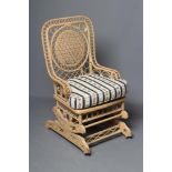 A HEYWOOD & WAKEFIELD STYLE GARDEN ROOM PLATFORM ROCKER, the mildly arched wicker back woven with