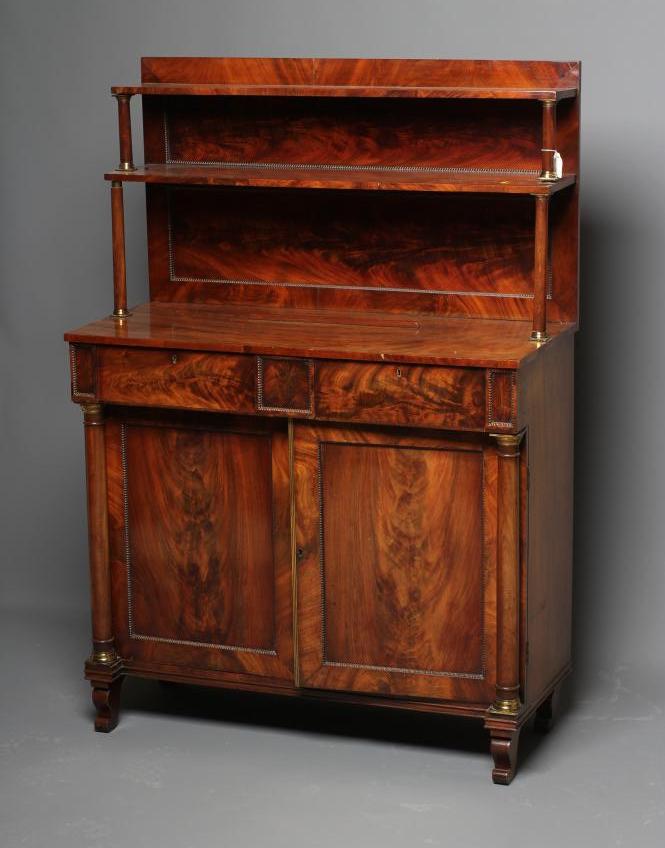 A REGENCY MAHOGANY CHIFFONIER, early 19th century, the raised shelved back on turned column