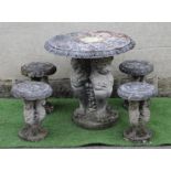 A CAST STONE TABLE, the circular top with ovolu rim on lion monopodiae supports and circular base,
