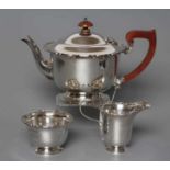 A SILVER THREE PIECE TEA SERVICE, maker Grant & Son, Birmingham 1938, of rounded cylindrical form