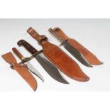 THREE 20TH CENTURY BOWIE KNIVES comprising a Western W49 with 9 3/8" blade, a Wright & Son knife