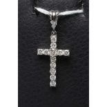 A DIAMOND CROSS PENDANT, the twelve small round brilliants claw set to an 18ct white gold frame with