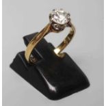 A SOLITAIRE DIAMOND RING, the brilliant cut stone of approximately 0.60cts, claw set to a plain