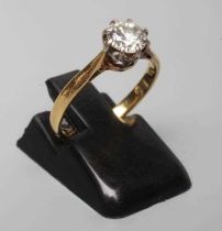 A SOLITAIRE DIAMOND RING, the brilliant cut stone of approximately 0.60cts, claw set to a plain