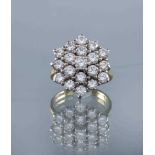 A DIAMOND CLUSTER RING, the nineteen round brilliants totalling approximately 3.25cts, point set