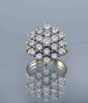 A DIAMOND CLUSTER RING, the nineteen round brilliants totalling approximately 3.25cts, point set