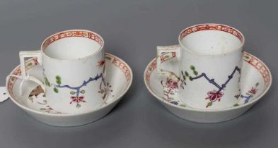 TWO MARCOLINI MEISSEN PORCELAIN CANS AND SAUCERS, late 18th century, painted in polychrome enamels