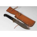 A PUMA 6030 ALASKAN HUNTING KNIFE, 26182, with 5 5/8" clip point blade, two piece ebony grip and