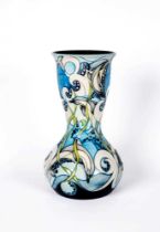 A MOORCROFT POTTERY LARGE VASE, 2004, of baluster form with flared rounded cylindrical neck,