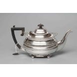 AN EDWARDIAN SILVER TEAPOT, maker Nathan & Hayes, Chester 1906, of squat oblong baluster form with