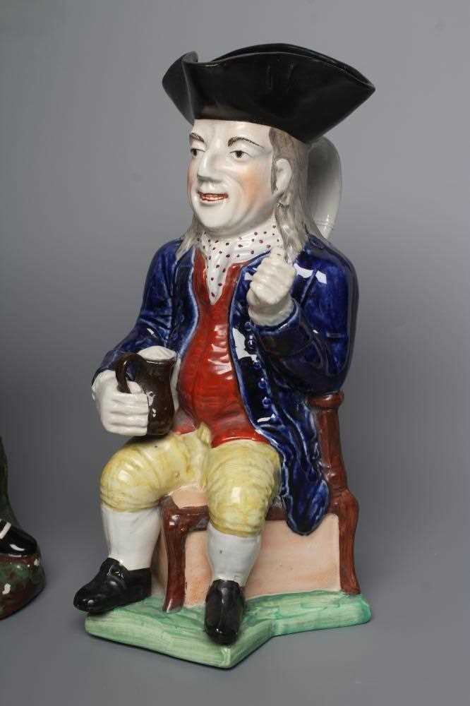 A STAFFORDSHIRE POTTERY SQUIRE TOBY JUG, early 20th century, wearing a black tricorn hat, underglaze - Image 2 of 4