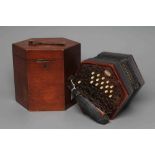 A LACHENAL & CO. CONCERTINA of typical hexagonal form, with fret carved scroll design to both