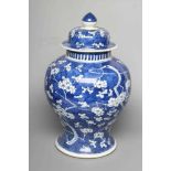 A CHINESE PORCELAIN LARGE JAR AND COVER of inverted baluster form, painted in underglaze blue with