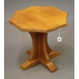 DAVID LANGSTAFF, AN ADZED OAK COFFEE TABLE, the concave sided octagonal top on waisted cruciform