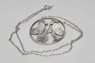 A GEORG JENSEN SILVER CIRCULAR PENDANT to match the previous lot, fixed to a fine chain necklace,