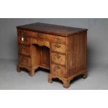 A GEORGIAN MAHOGANY KNEEHOLE DRESSING TABLE, third quarter 18th century, the moulded edged rounded