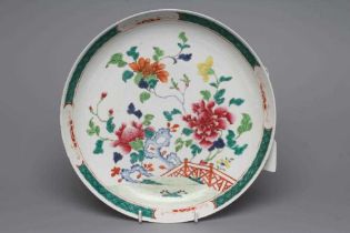 A CHINESE PORCELAIN SAUCER DISH of plain circular form painted in colours with large flowers, blue