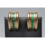 A PAIR OF EMERALD FRENCH CLIP EARRINGS to match the previous lot, each set with eight stones,