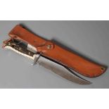 A PUMA 8396 ORIGINAL BOWIE KNIFE, 16281, with 6 1/2" clip point blade, two piece antler grips and