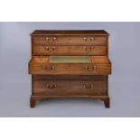 A GEORGIAN MAHOGANY SECRETAIRE CHEST, late 18th century, the moulded edged top over five graduated