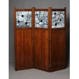 AN OAK THREE FOLD PANELLED ROOM SCREEN, c.1900, each fold with upper leaded glazed opaque and