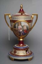 A VIENNA PORCELAIN TWO HANDLED CUP, COVER AND STAND, late 19th century, the rounded conical body