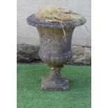 A WHITE MARBLE CAMPANA URN of half fluted plain form with moulded rim, raised on fluted socle and