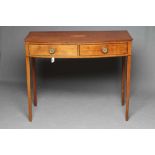 A GEORGIAN MAHOGANY SIDE TABLE, c.1800, of bowed form with stringing, the moulded edged top with