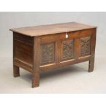 AN OAK PANELLED COFFER, early 18th century, the moulded edged plank lid opening to interior with