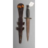 A FAIRBAIRN & SYKES DAGGER with 7" double edged blade, brass crossguard, ribbed brass grip and