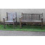 A SLATTED TEAK BENCH with straight back and square section arm suppports and feet, 48" x 18 1/2" x