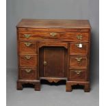 A GEORGIAN MAHOGANY AND STRING INLAID KNEEHOLE DRESSING TABLE, late 18th century, the reeded edged