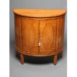 A SATINWOOD COMMODE, 20th century, of demi lune form with rosewood banding and ebony and box