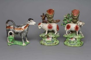 A PAIR OF WALTON EARTHENWARE SPILL VASES, early 19th century, modelled as a ram and ewe both