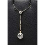 A DIAMOND PENDANT, the open back collet set brilliant cut stone of approximately 0.9cts, hung from
