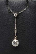 A DIAMOND PENDANT, the open back collet set brilliant cut stone of approximately 0.9cts, hung from