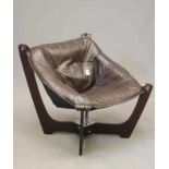AN ODD KNUTSEN DESIGN LUNA LOUNGE CHAIR of low back form manufactured by IMG Norway, the brown