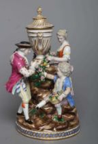 A MEISSEN PORCELAIN FIGURE GROUP, 19th century, modelled as a young couple threading a flower