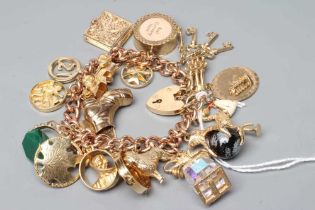 A 9CT GOLD CURB LINK CHAIN BRACELET with padlock fastener, hung with eighteen charms including