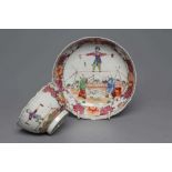 A CHINESE PORCELAIN FAMILLE ROSE TEA BOWL AND SAUCER painted with a tightrope walker and a knife