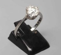 A SOLITAIRE DIAMOND RING, the brilliant cut stone of approximately 1.50cts claw set to a plain,