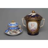 A FRENCH PORCELAIN LARGE TWO HANDLED CUP AND COVER, 19th century, of flared cylindrical form painted