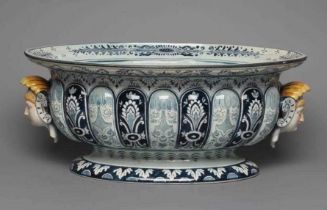 A VILLEROY & BOCH FAIENCE CISTERN, late 19th century, of lobed oval form with two female mask lug