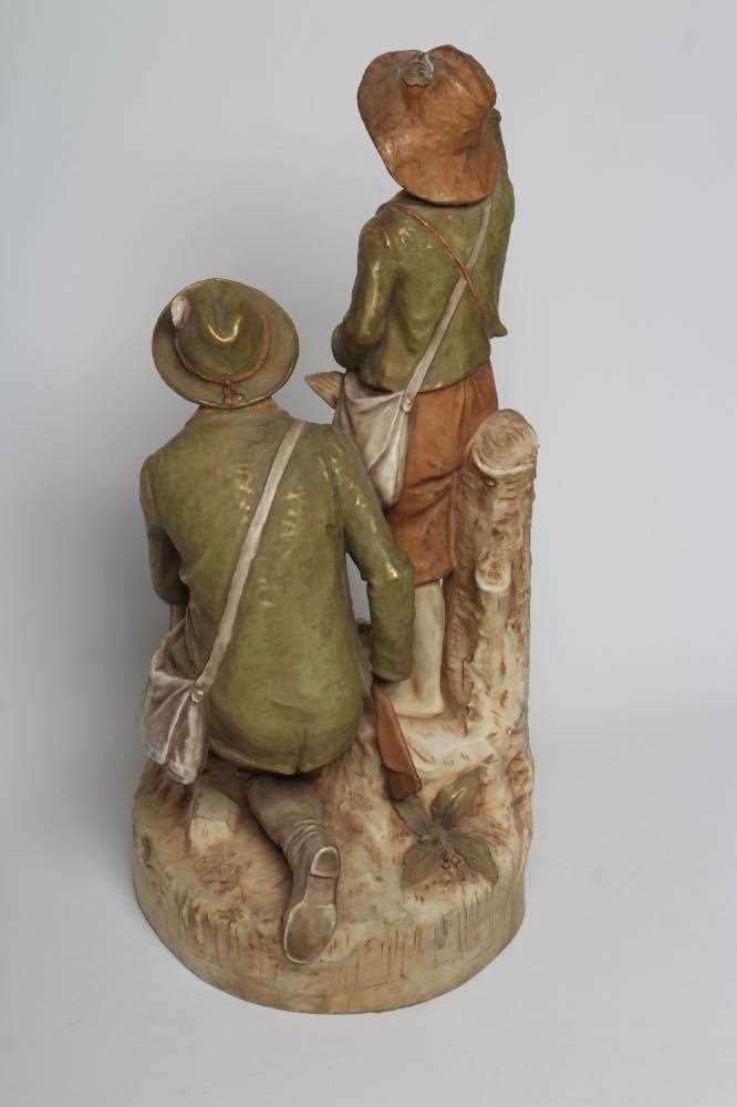 A ROYAL DUX BISQUE PORCELAIN FIGURE GROUP, early 20th century, modelled as a father holding a double - Image 4 of 5