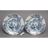 A PAIR OF ENGLISH DELFT PLATES, probably Liverpool c.1760, painted in blue with a fence, weeping